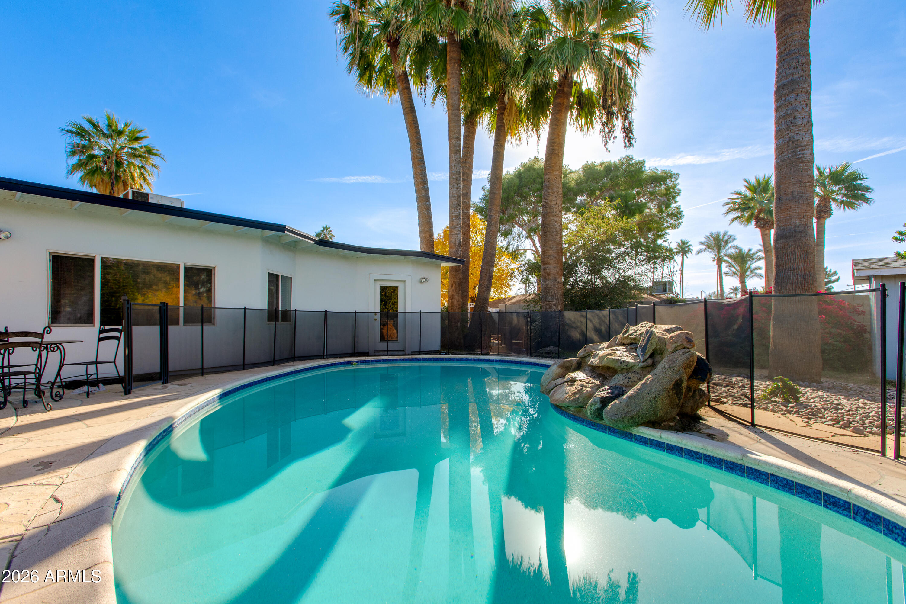 7830 North 7th Avenue Phoenix, AZ 85021 - Photo 42 of 43 a swimming pool with outdoor seating and yard