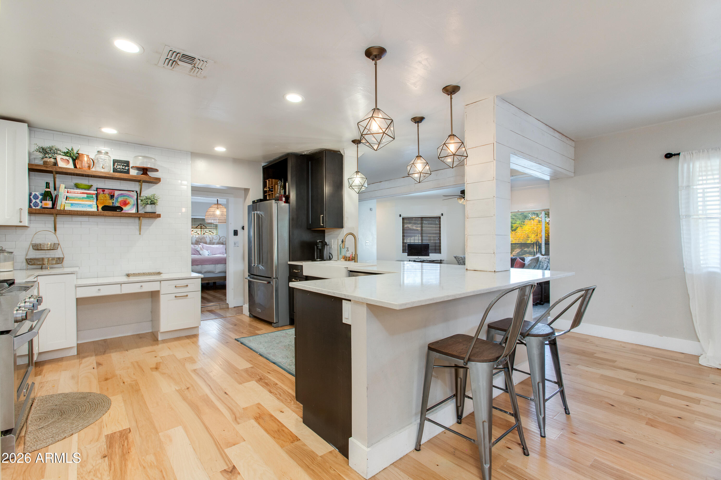 7830 North 7th Avenue Phoenix, AZ 85021 - Photo 10 of 43 a kitchen with cabinets and wooden floor