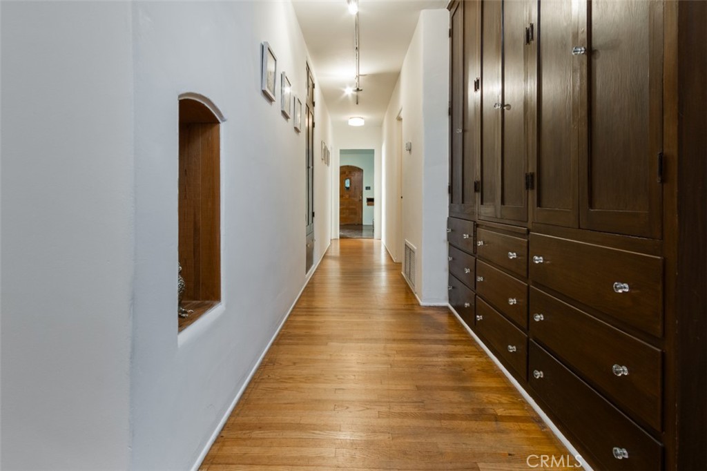 254 South Berkeley Avenue Pasadena, CA 91107 - Photo 12 of 40 a view of a hallway with wooden floor