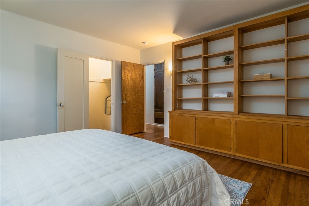 254 South Berkeley Avenue Pasadena, CA 91107 - Photo 14 of 40 a bedroom with a bed and a cabinet