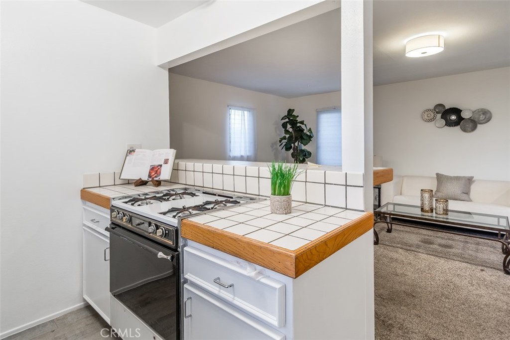 254 South Berkeley Avenue Pasadena, CA 91107 - Photo 32 of 40 a kitchen that has a stove and a table