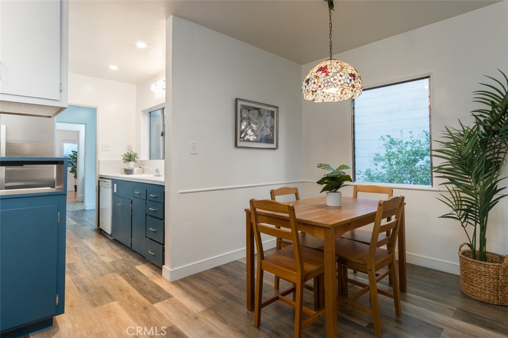 254 South Berkeley Avenue Pasadena, CA 91107 - Photo 5 of 40 a dining room with furniture potted plants and wooden floor