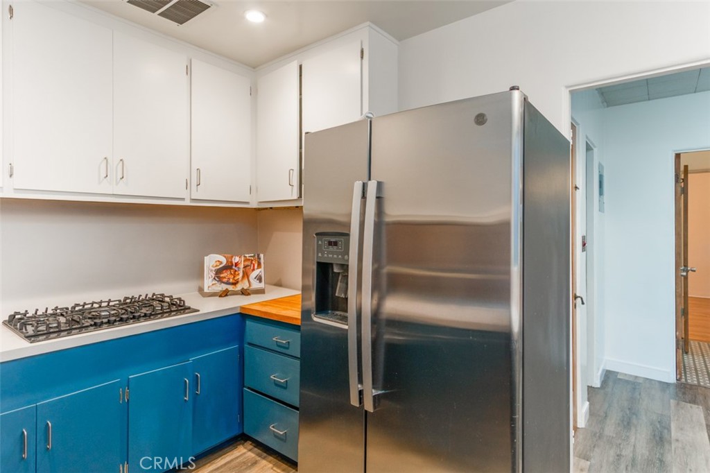 254 South Berkeley Avenue Pasadena, CA 91107 - Photo 6 of 40 a kitchen with granite countertop a refrigerator and a sink