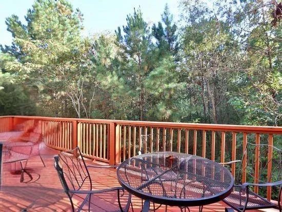 a view of balcony with furniture