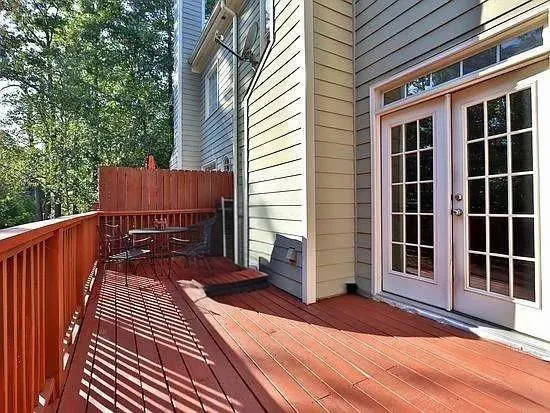 a view of a house with a door and wooden floor