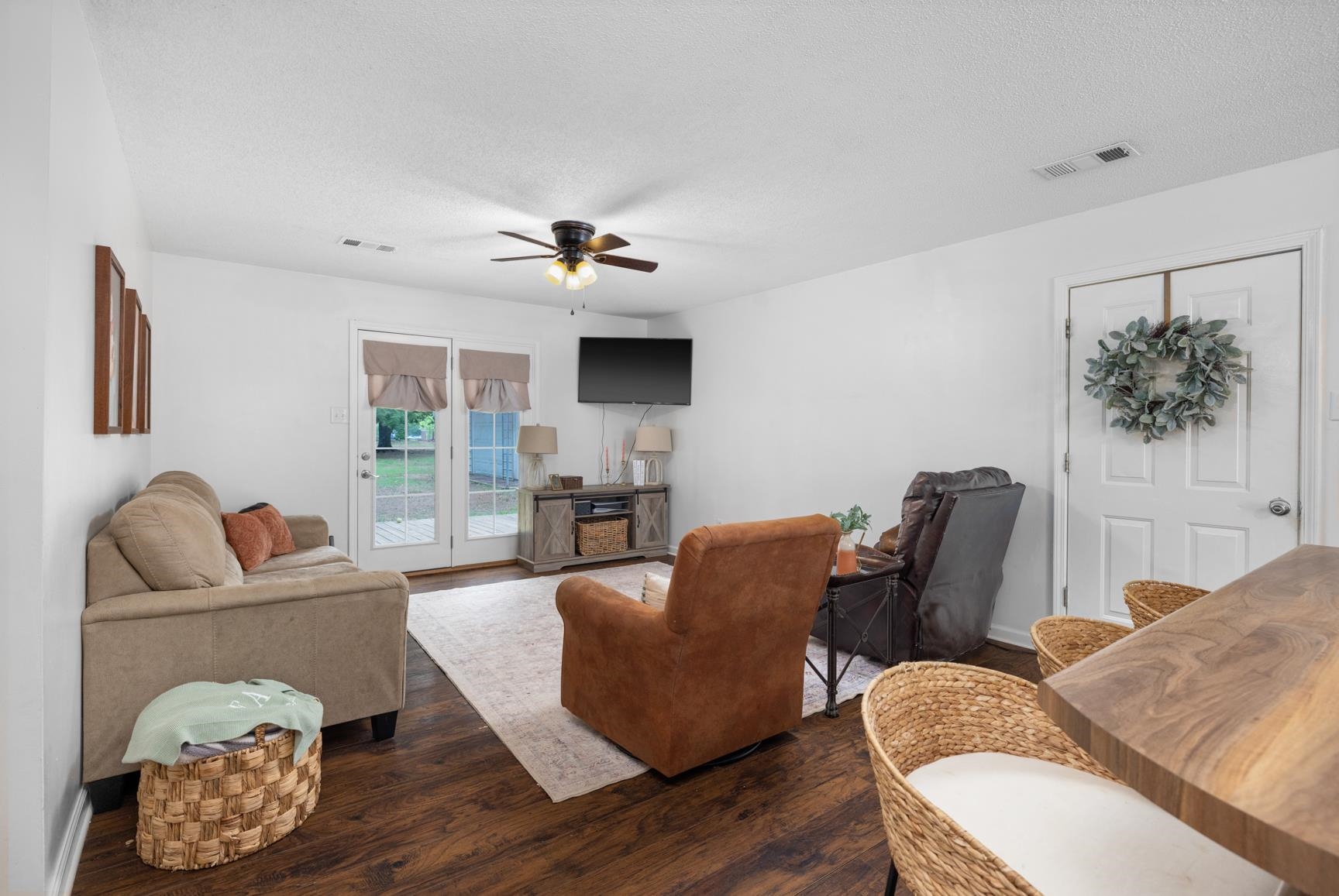586 Beaver Road Munford, TN 38058 - Photo 4 of 21 Open-concept living space featuring wood-finish flooring, white walls, and a ceiling fan