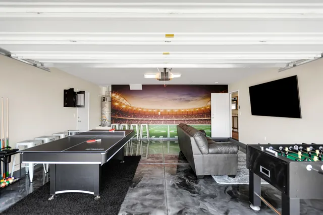 a hallway with white walls and wooden floor
