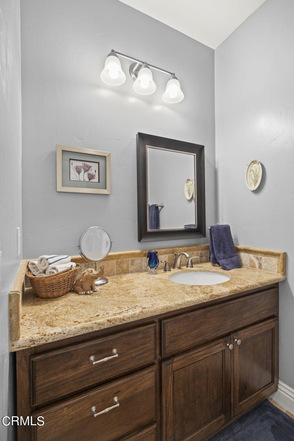 1006 Mesa Drive Camarillo, CA 93010 - Photo 48 of 74 a bathroom with a granite countertop sink and a mirror