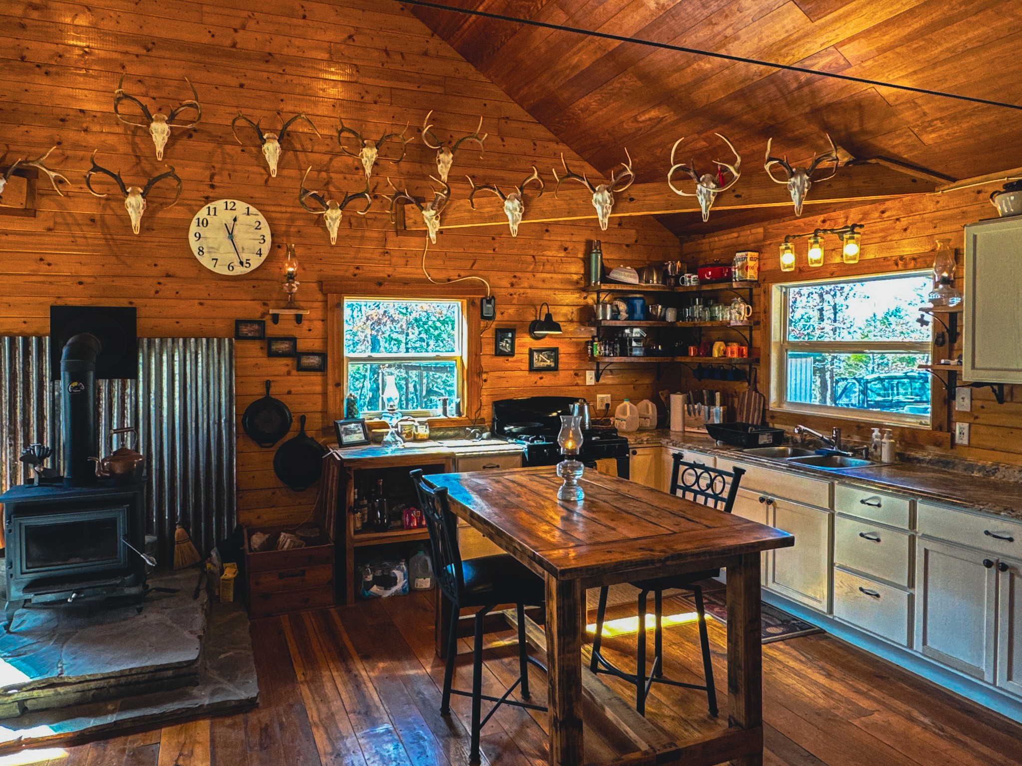 0 Bunker Hill Road Linden, TN 37096 - Photo 16 of 65 a kitchen with a sink a window and dining table in it