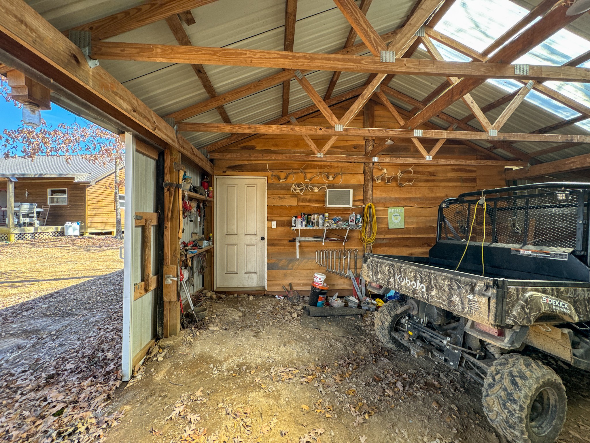 0 Bunker Hill Road Linden, TN 37096 - Photo 26 of 65 a view of a garage with a table and chairs