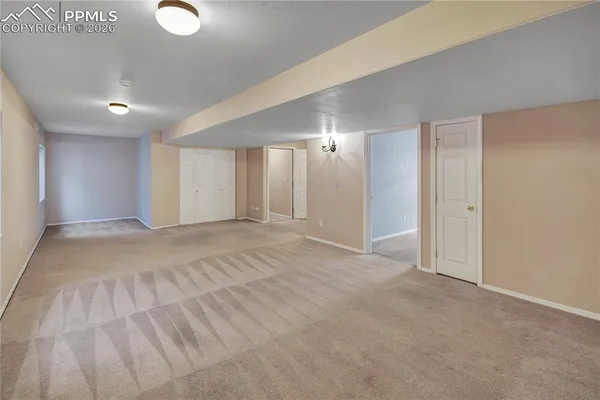 a view of an empty room and window