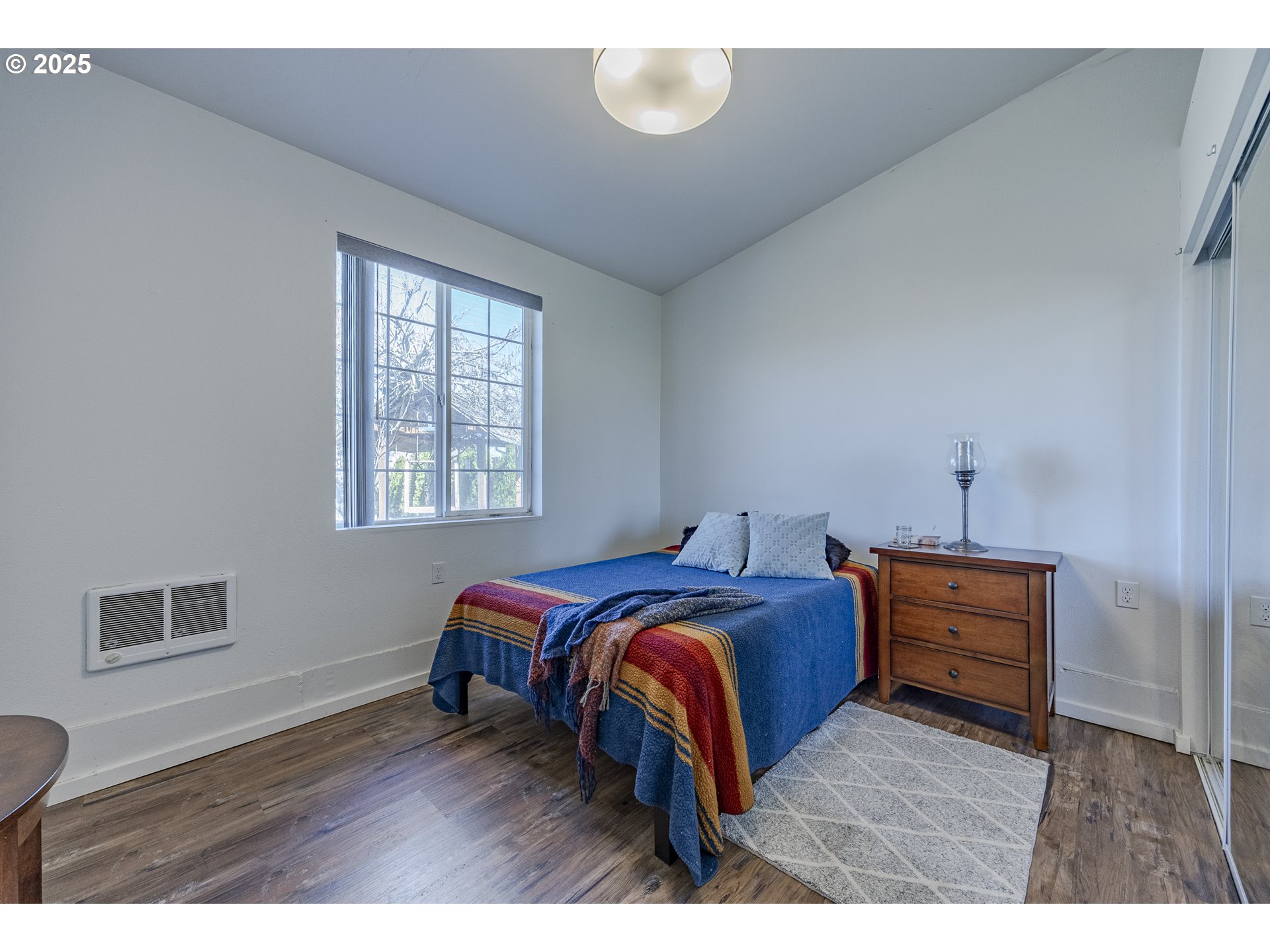 789 66th Street Springfield, OR 97478 - Photo 34 of 37 a bedroom with a bed and wooden floor