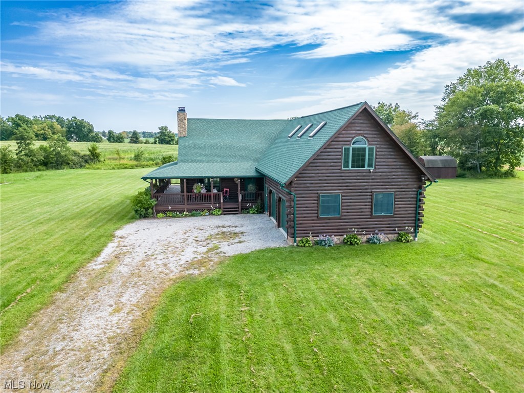 46069 Stewart Road Wellington, OH 44090 - Photo 2 of 29 Log home with front view of home