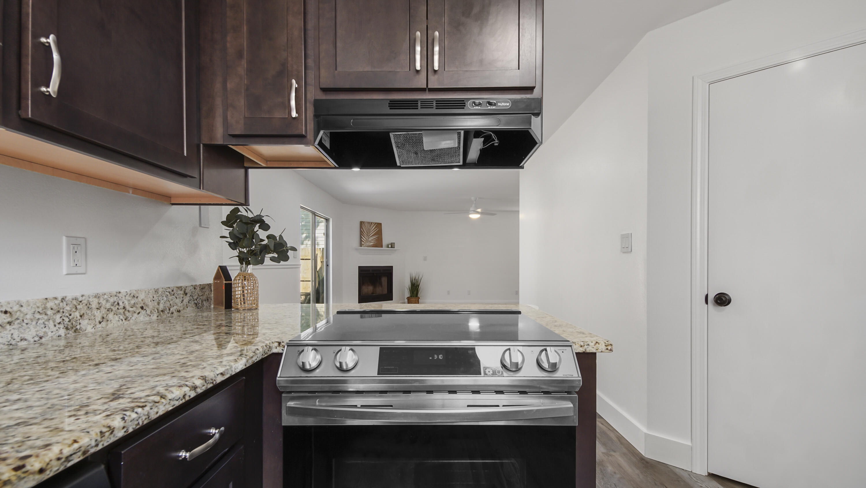 44 Ruby Circle Mary Esther, FL 32569 - Photo 13 of 34 a kitchen with stainless steel appliances granite countertop a stove and a microwave