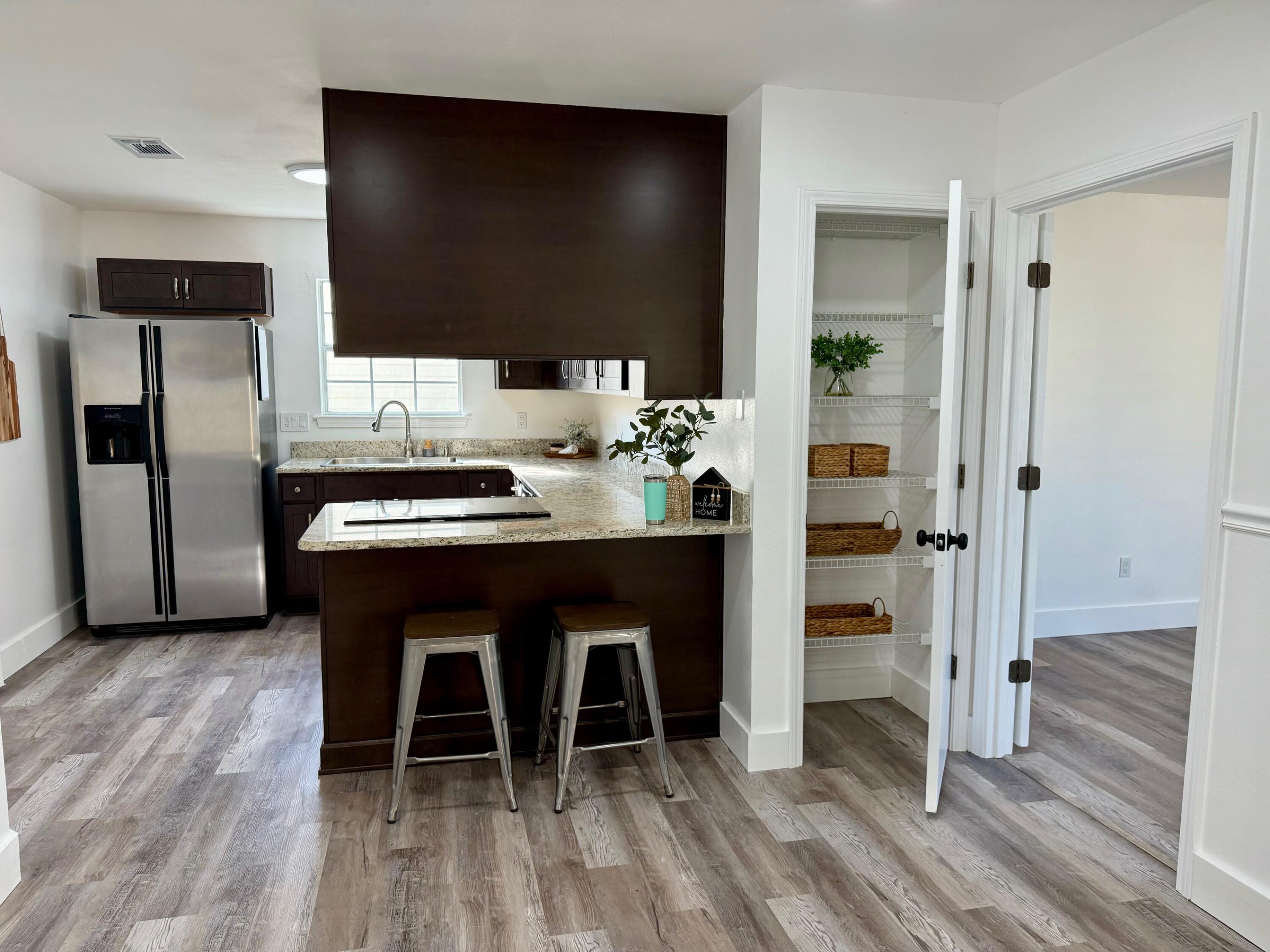 44 Ruby Circle Mary Esther, FL 32569 - Photo 14 of 34 a dining room with furniture and wooden floor