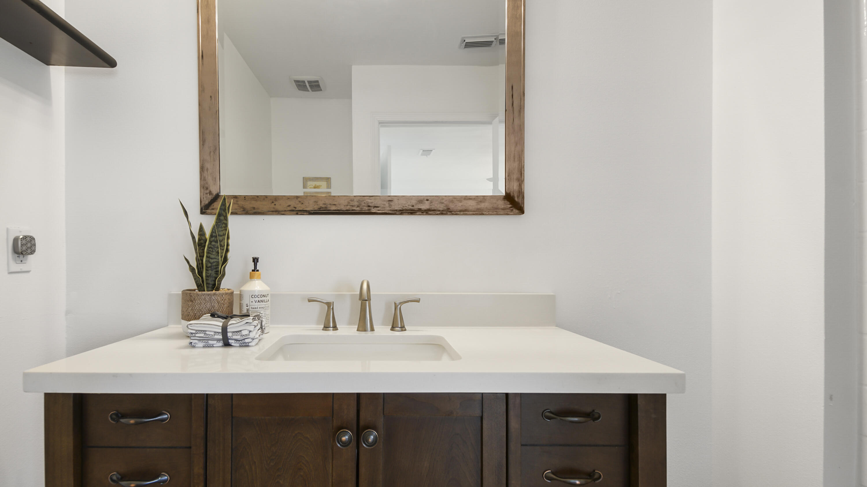 44 Ruby Circle Mary Esther, FL 32569 - Photo 18 of 34 a bathroom with a sink vanity and a mirror