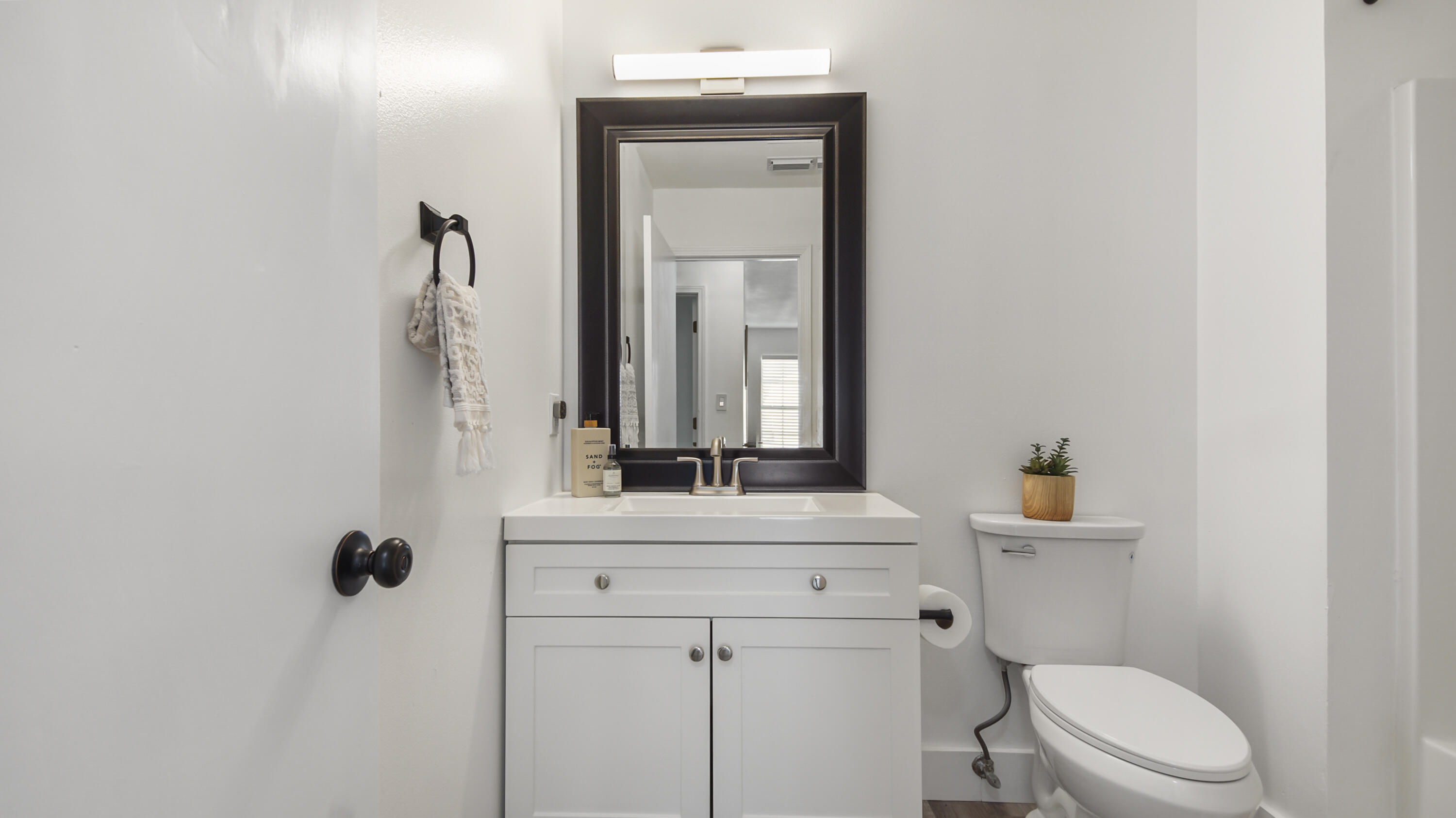 44 Ruby Circle Mary Esther, FL 32569 - Photo 22 of 34 a bathroom with a sink a toilet and mirror