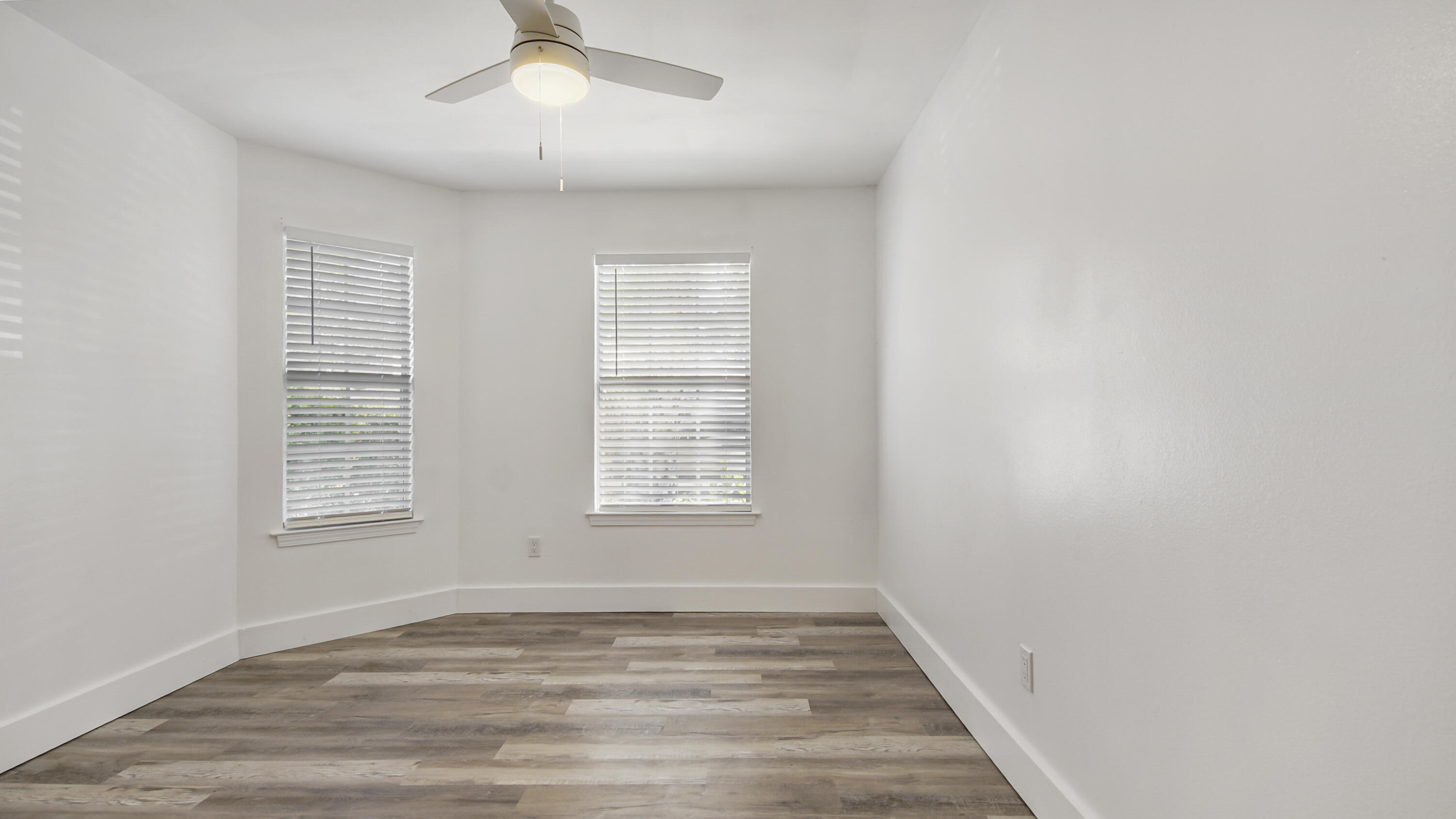 44 Ruby Circle Mary Esther, FL 32569 - Photo 24 of 34 a view of an empty room with wooden floor and a window