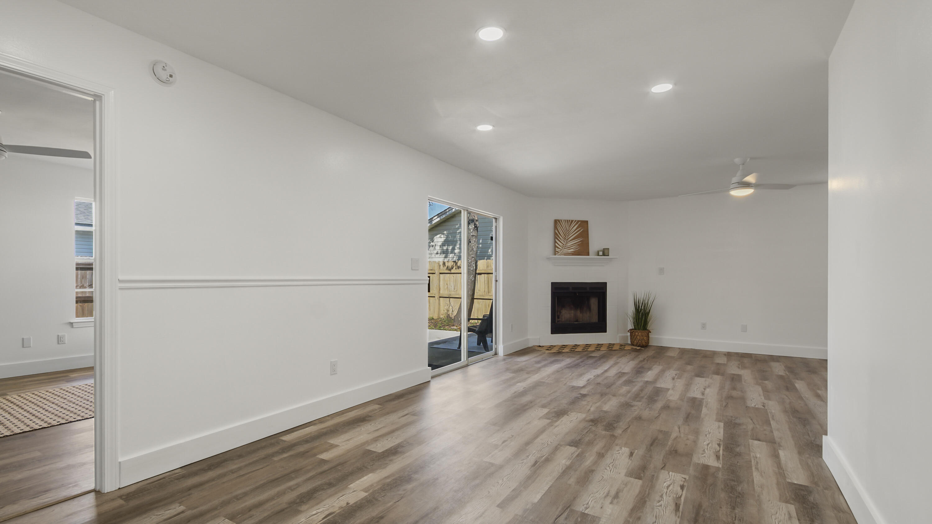 44 Ruby Circle Mary Esther, FL 32569 - Photo 30 of 34 a view of a livingroom with an empty space and a fireplace