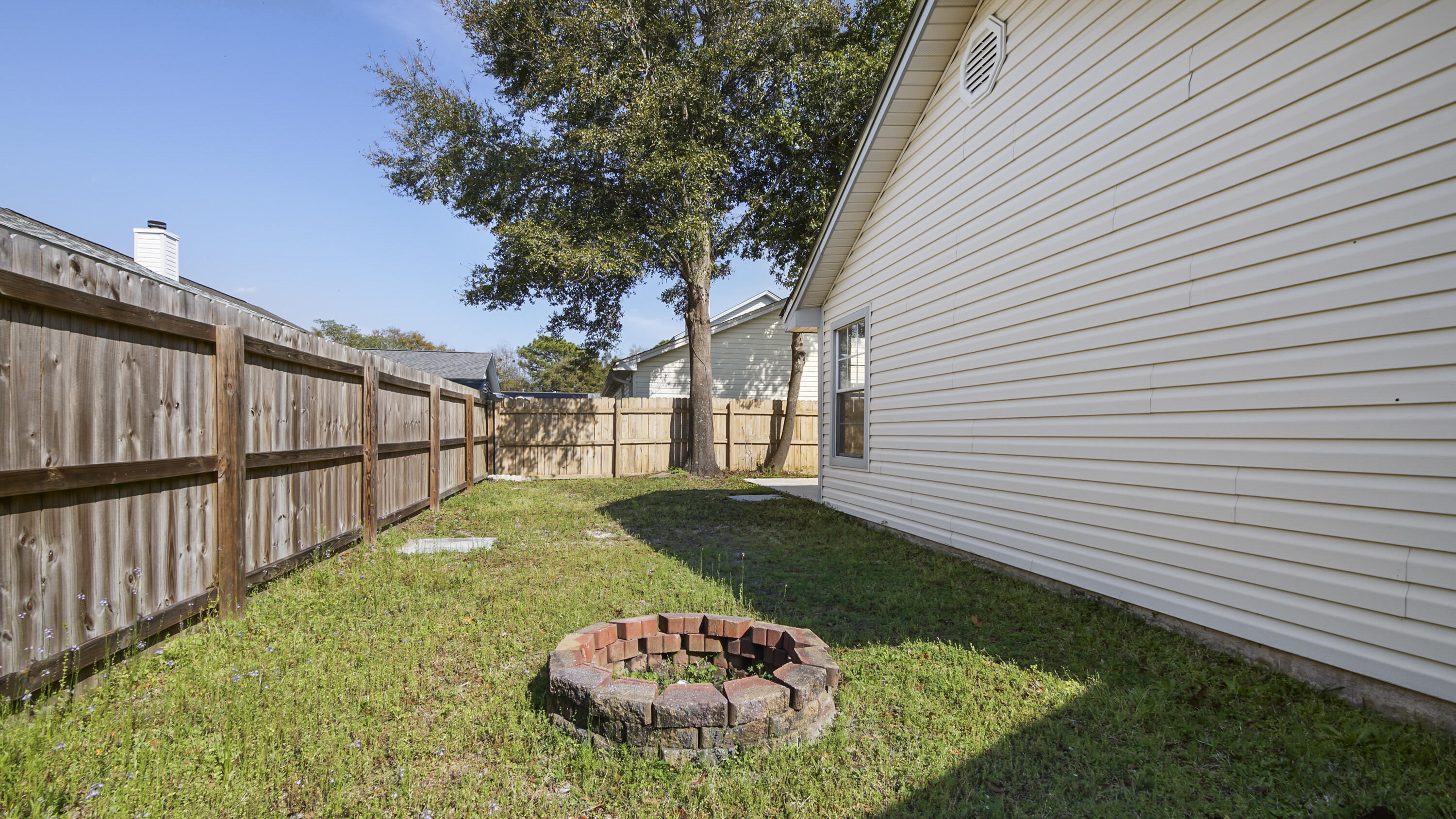 44 Ruby Circle Mary Esther, FL 32569 - Photo 32 of 34 a view of a backyard with a garden