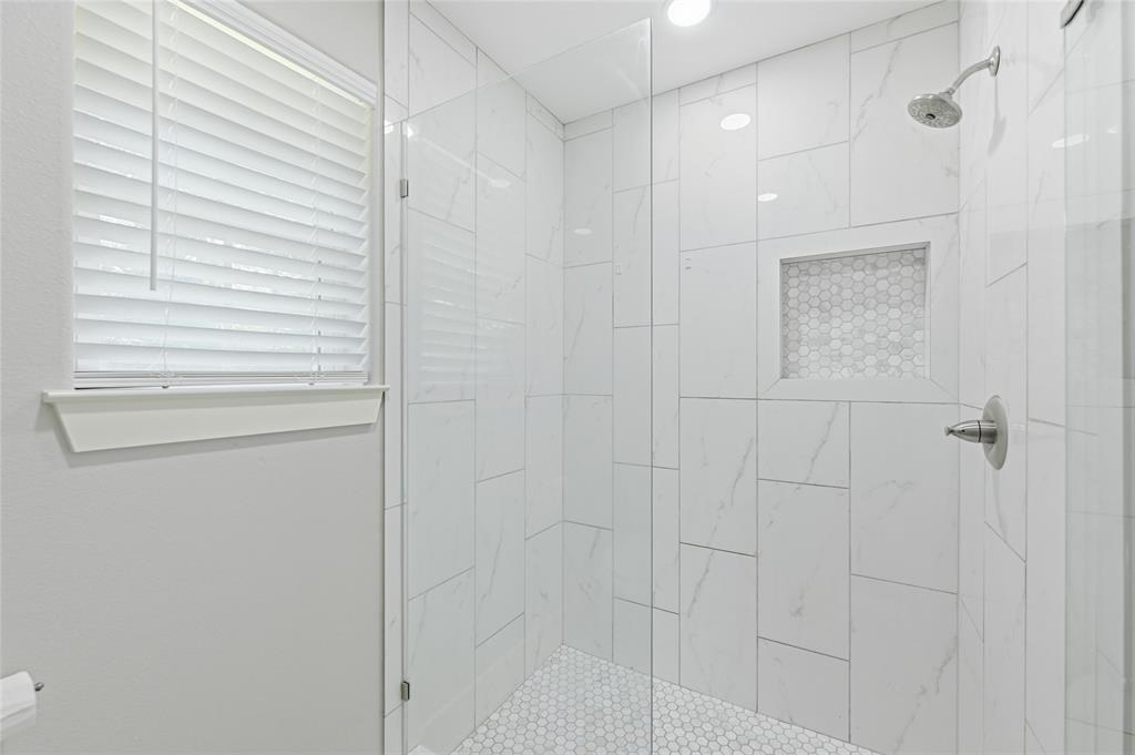 318 Munson Street Denison, TX 75021 - Photo 12 of 21 a bathroom with a shower