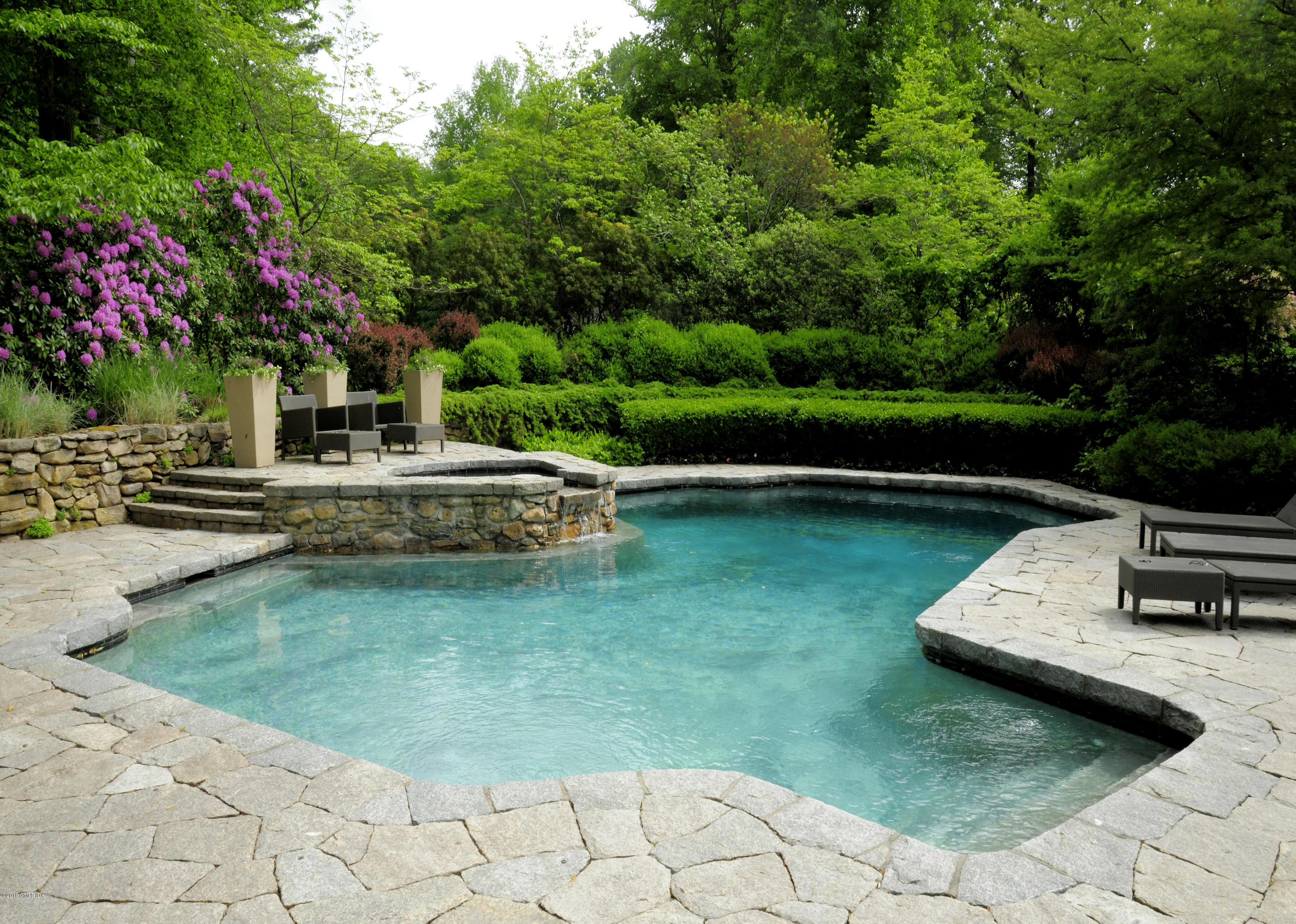 74 Upper Cross Road Greenwich, CT 06831 - Photo 17 of 21 a swimming pool with barbeque oven outdoor seating and green space