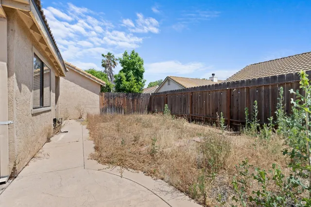 a backyard of a house with lots of green space