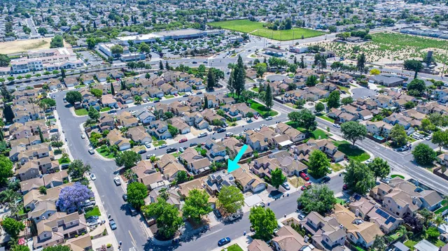 an aerial view of residential houses with outdoor space
