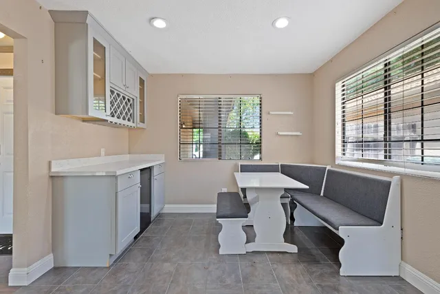 a work room with furniture and windows