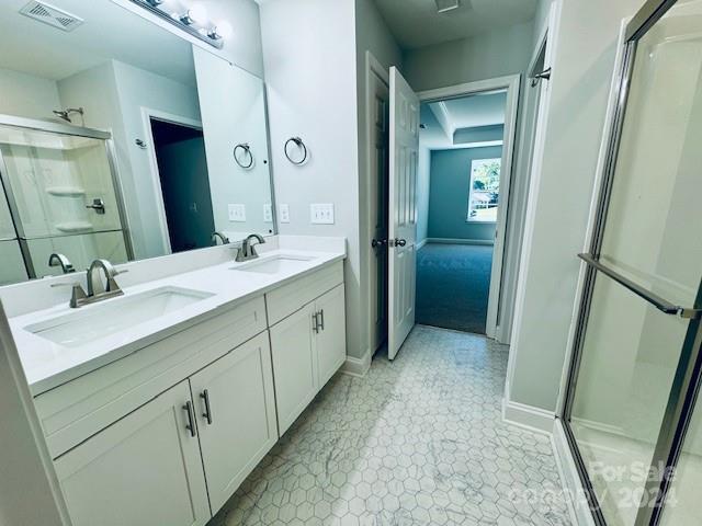 5103 Lakeview Road Charlotte, NC 28216 - Photo 8 of 12 a spacious bathroom with a double vanity sink a mirror and a