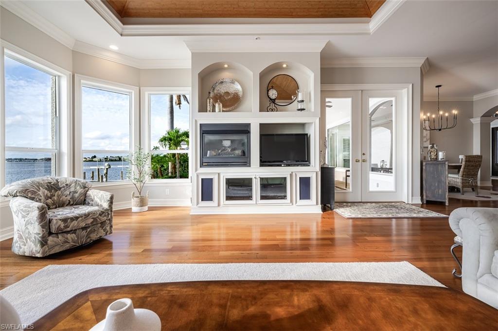 1942 Kingfish Road Naples, FL 34102 - Photo 13 of 43 a living room with furniture and a large window