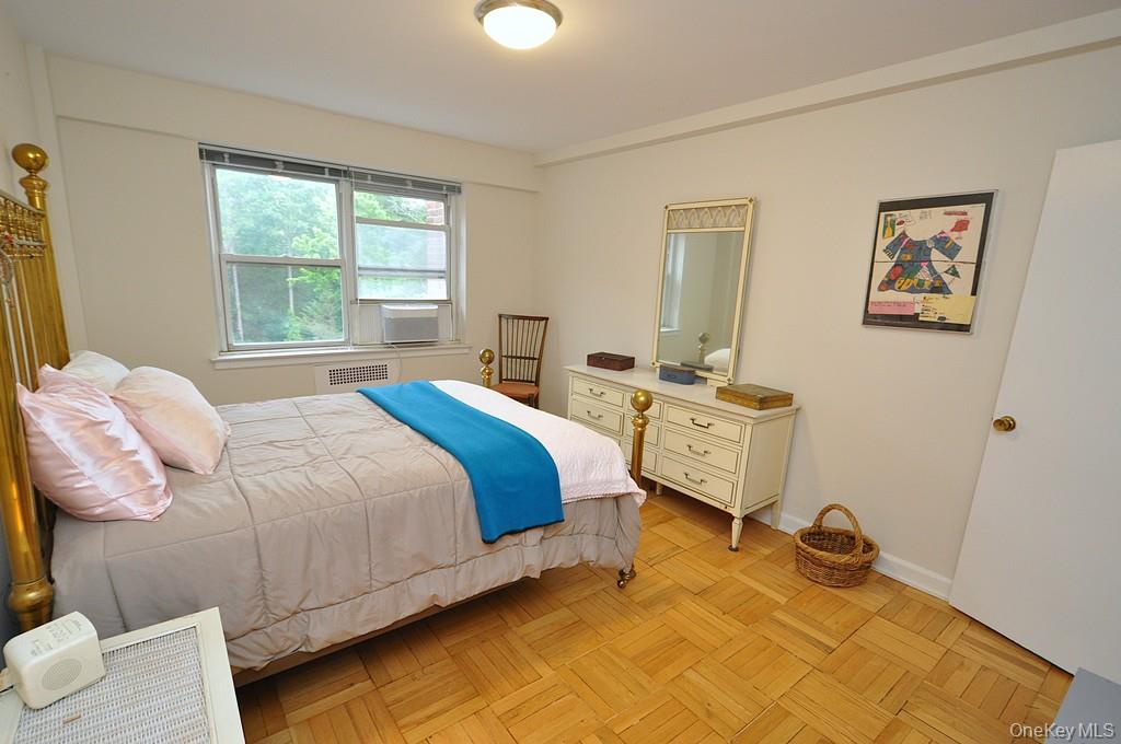 235 Garth Road, Unit A5B Scarsdale, NY 10583 - Photo 24 of 47 a bedroom with a bed and window