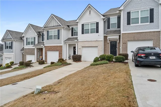 a house view with a car parked front of it