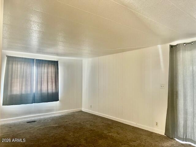2605 South Tomahawk Road, Unit 187 Apache Junction, AZ 85119 - Photo 12 of 34 an empty room with windows