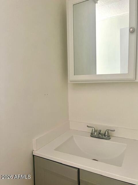2605 South Tomahawk Road, Unit 187 Apache Junction, AZ 85119 - Photo 15 of 34 a bathroom with a sink and cabinets