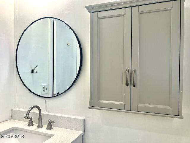 2605 South Tomahawk Road, Unit 187 Apache Junction, AZ 85119 - Photo 20 of 33 a bathroom with a sink and a mirror
