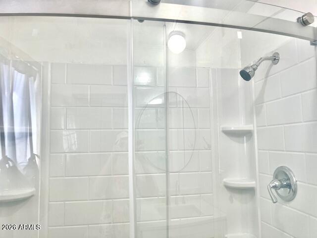 2605 South Tomahawk Road, Unit 187 Apache Junction, AZ 85119 - Photo 21 of 33 a bathroom with a shower and a shower