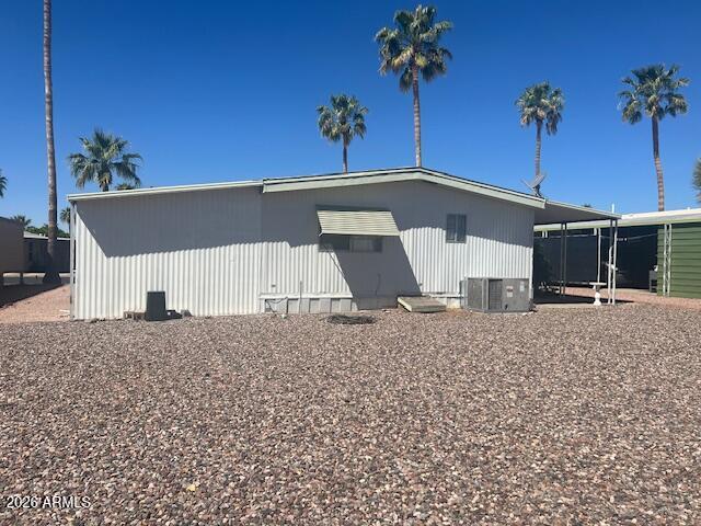 2605 South Tomahawk Road, Unit 187 Apache Junction, AZ 85119 - Photo 30 of 33 a view of a house with a yard and potted plants