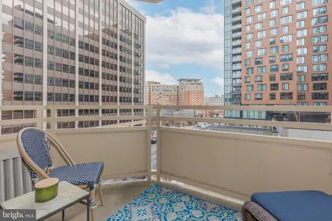a view of a chair and table in a balcony