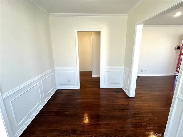 a view of room with wooden floor