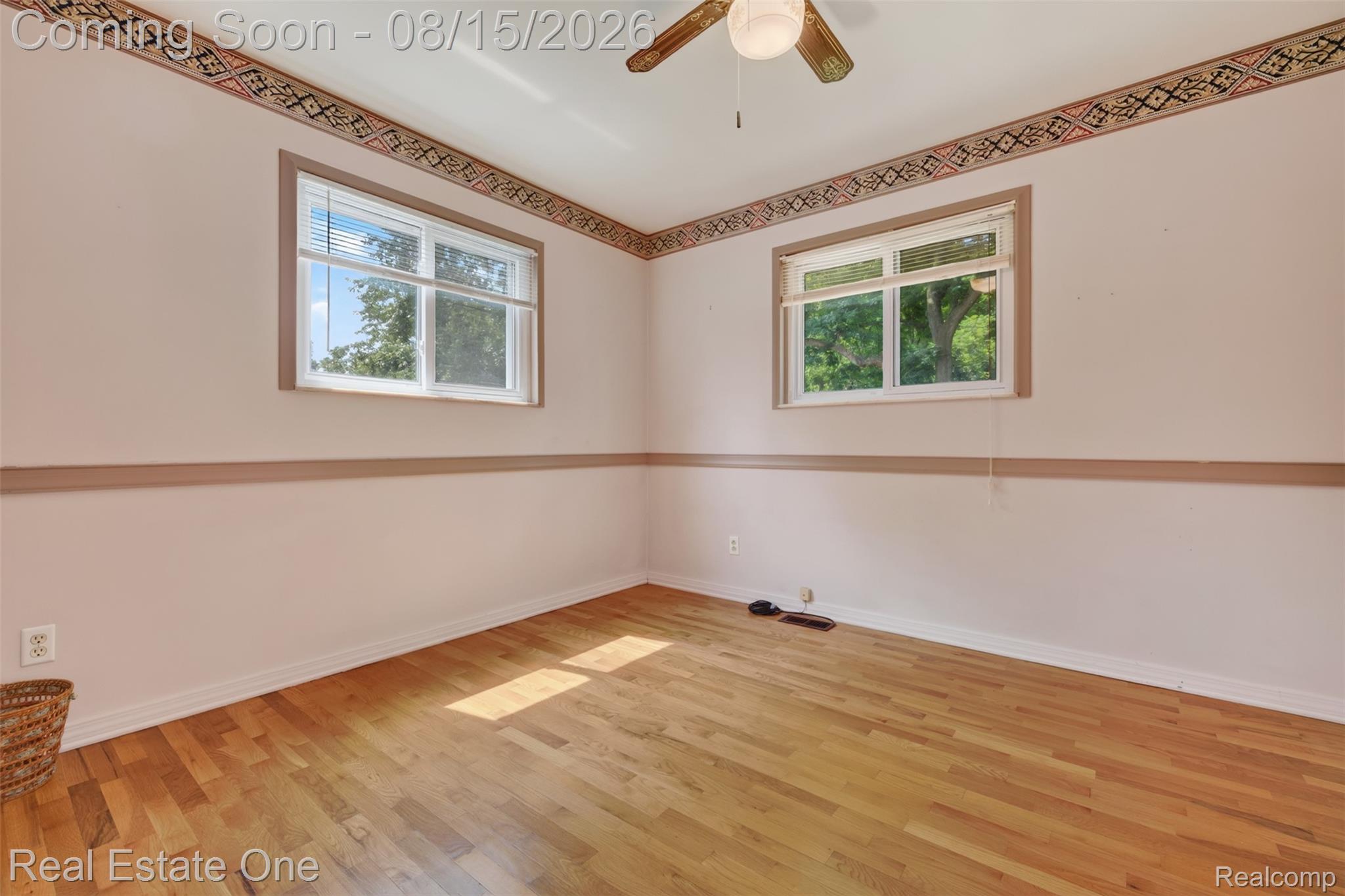 454 South Baldwin Road Oxford, MI 48371 - Photo 18 of 64 Bright corner bedroom features cross-ventilation, trim molding, and large closet and organizer.