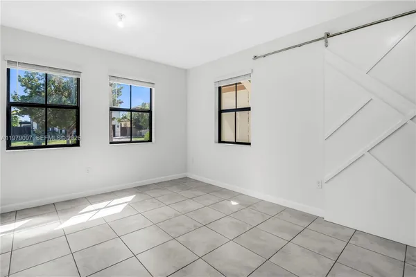 a bathroom with a double vanity sink mirror and shower