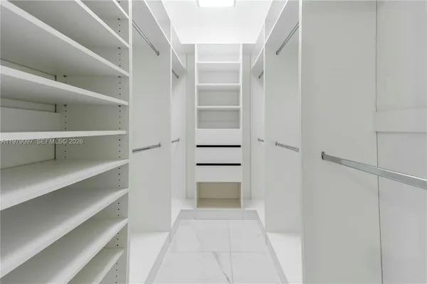 a bathroom with a sink toilet vanity and shower