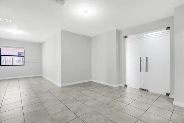 a view of an empty room and window