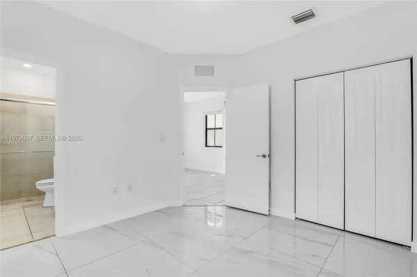 a view of an empty room and window