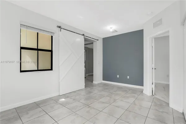 an aerial view of a house with a swimming pool