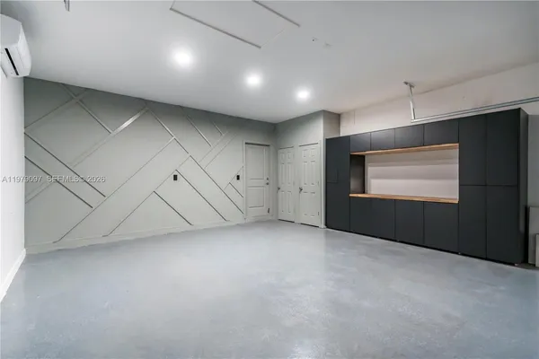 an aerial view of a house with swimming pool and outdoor space