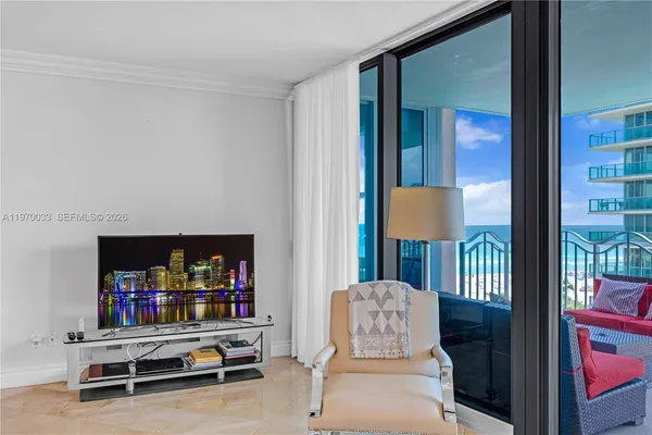 a living room with furniture and a window