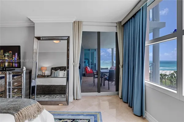 a bedroom with furniture and a window