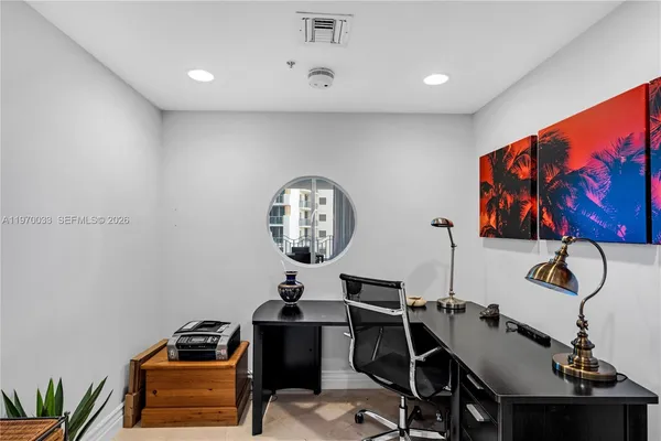 a room with furniture and musical instruments
